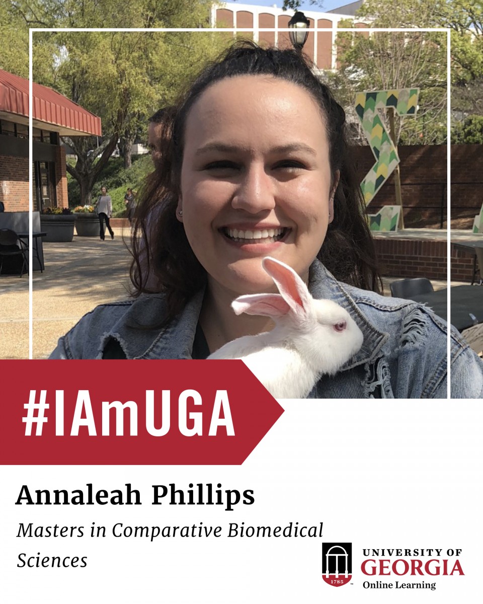 Annaleah Phillips, Masters in Comaparative Biomedical Sciences. Phillips is holding a bunny on campus. 