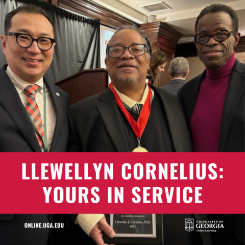 Llewellyn Cornelius holding award