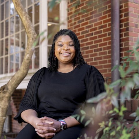 Portrait of Kimberly Watkins, Assistant Professor of Financial Planning, Housing and Consumer Economics in the College of Family and Consumer Sciences, outside the Charles Schwab Financial Planning Center.