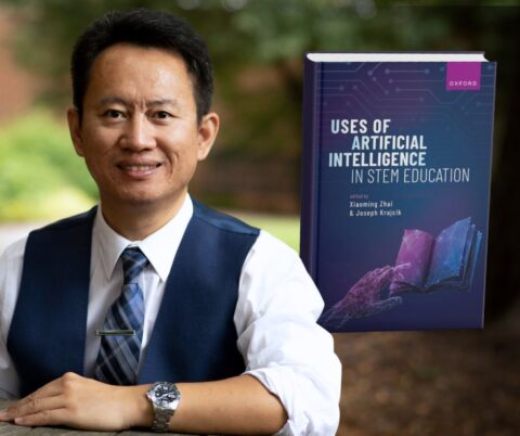 Xiaoming Zhai headshot in front of his book, Uses of Artificial Intelligence in STEM Education