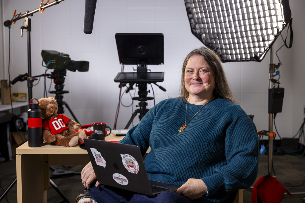 Environmental portrait of Amy Ragland, an instructional designer in the Office of Online Learning, in a video studio at her office’s headquarters in Brooks Hall.