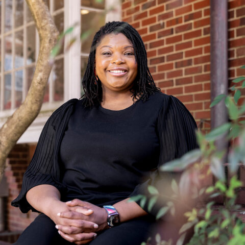 Portrait of Kimberly Watkins, Assistant Professor of Financial Planning, Housing and Consumer Economics in the College of Family and Consumer Sciences, outside the Charles Schwab Financial Planning Center.