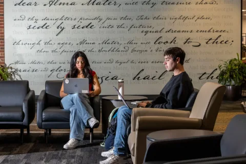 Undergraduate students studying on laptops at the Tate Student Center. (Photo by Dorothy Kozlowski/UGA)
